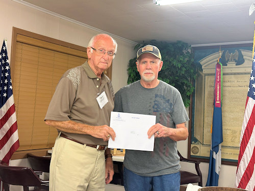 Registrar Dennis Beckham presents the Supplemental Certificate for Richard Waddell to Compatriot Thomas Owen for his ancestor.