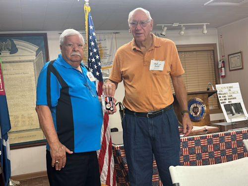 President Clarence Burns presents The Texas Chapter Service Medal to Vice President Joe Reynolds for his accomplishments during the year.