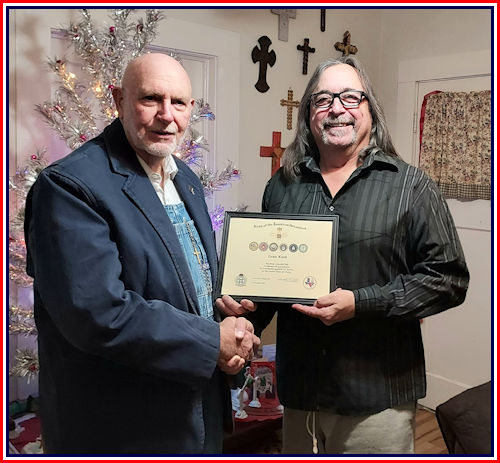 Adjutant Rodney Love presents Louis Koob with a Certificate of Appreciation for his service in the United States Army Air Force.