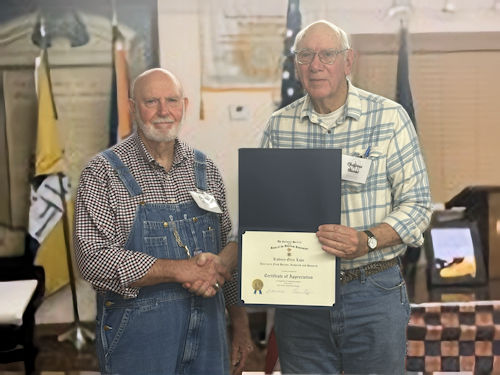 Secretary Rodney Love is presented with a Certificate of Appreciation from President Clarence Burns for presenting the program tonight.